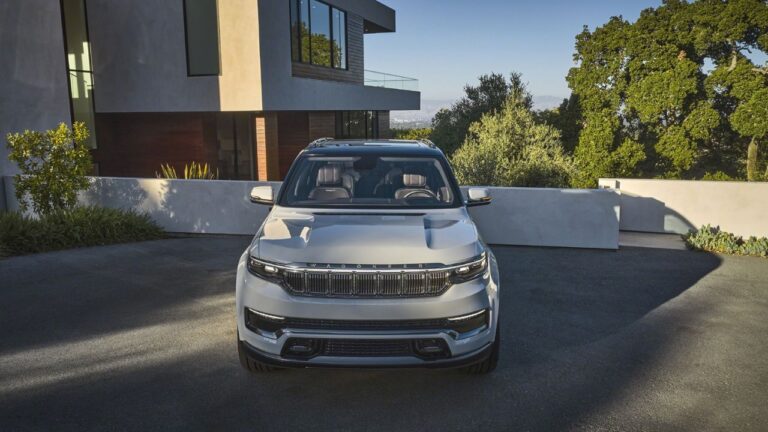 Subaru Outback and Jeep Grand Cherokee parked side by side showcasing design and size differences